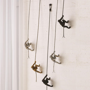 Global Views Climbing Man Wall Sculpture Bronze – room setting